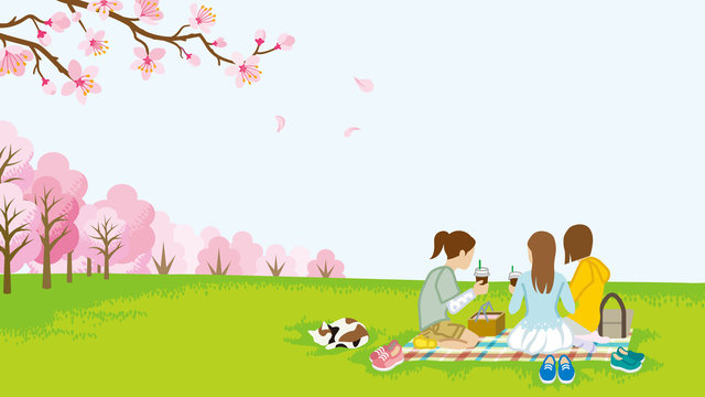 Three girls picnic in spring nature