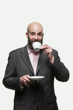 Man drinks a cup of coffee