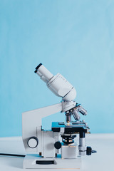 Powerful scientific laboratory microscope with multiple lenses.