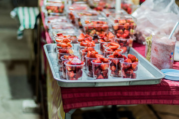 Strawberry in Cup for sale In market. Thailand