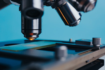 Powerful scientific laboratory microscope with multiple lenses.