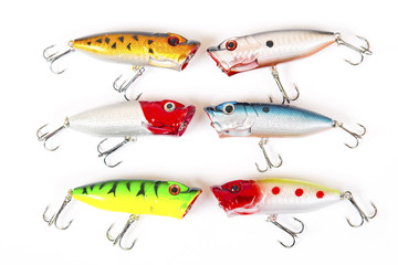 Set of fishing lures isolated on white. Wobblers in three color. Green, yellow and red colors.
