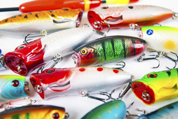 Set of fishing spinners and wobblers multi-colored background