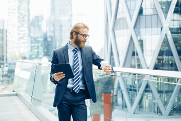 Businessman using a Tablet pc in financial district