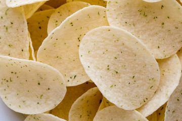 Close up potato chips on wood top view background.