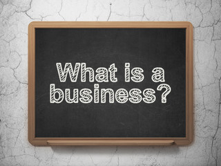 Finance concept: What is a Business? on chalkboard background