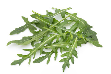 Close up studio shot of green fresh rucola isolated on white bac