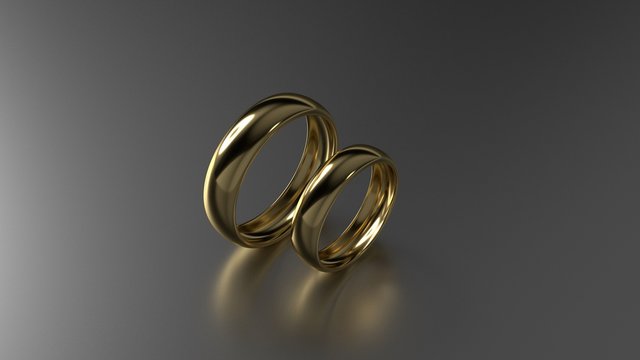 The beauty gold wedding rings on black background. 3d rendering