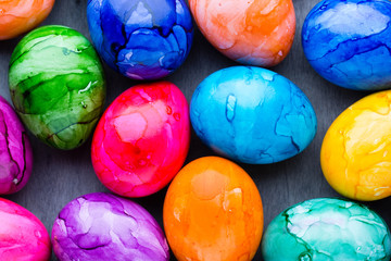 Easter eggs painted in colors on a pattern background.