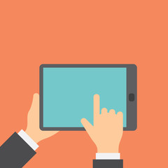 Finger clicks on tablet display with touch screen.