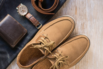 Close up vintage leather shoes man accessory. Men's casual outfits with accessories on rustic wood...