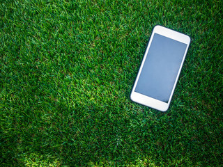 Smart phone on a artificial grass field