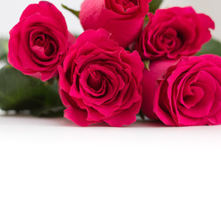 Closeup of red roses bouquet with copy-space, on white background.