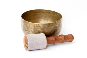 closeup of a tibetan bowl on a white background