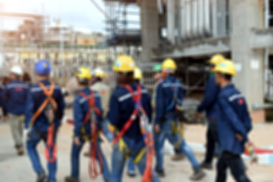 Blurred construction worker in construction site . Safety construction concept .