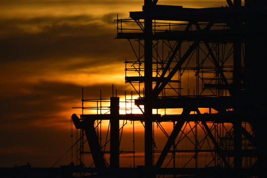 silhouette  construction site and sunset background.