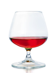 A glass of cognac on a white background