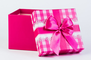 beautiful gift box with a bow on a white background.