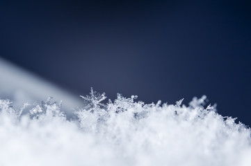 natural snowflakes on snow, photo real snowflakes during a snowfall, under natural conditions at...