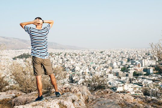 Greece, Athens, tourist looking at the city from Areopagus