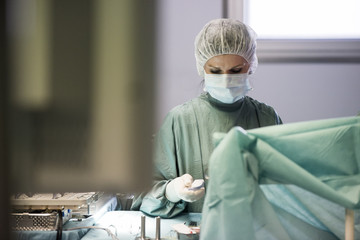 Operating room nurse looking down