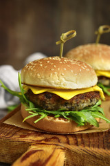 Cheeseburger with mushroom cutlet and arugula.