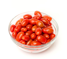 cherry tomatoes in a bowl on a white background
