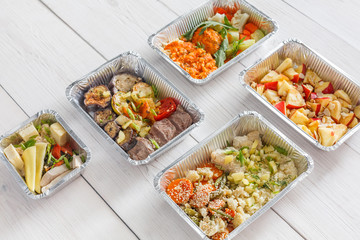 Healthy food take away, top view at wood background