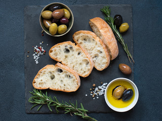 Olives, olive oil and Italian bread ciabatta