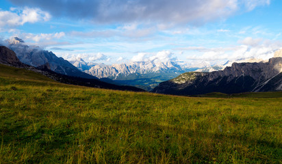 Obraz premium Meadow in front of the Alps. Dolomites,Italy