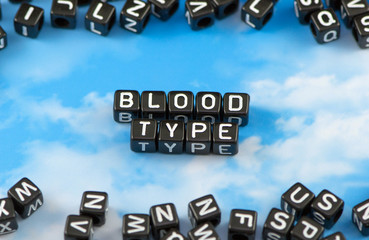 The word Blood type on the sky background