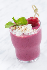 berry smoothie in a glass beaker, vertical