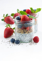 Breakfast in a jar, chia with berries and oat flakes 