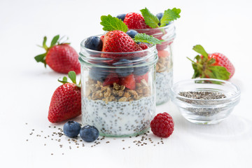 Breakfast in a jars, chia with berries and oat flakes 
