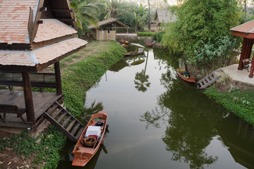 Fototapeta na wymiar Thai wooden house and boat