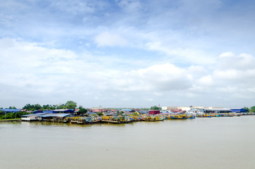 JOHOR, MALAYSIA - JANUARY 30, 2017: Fishing boats anchored at the jetty during the monsoon season at Endau, Johor, Malaysia. Endau is one of the most important fisheries in Johor.