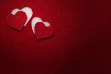 Red hearts made of felt.