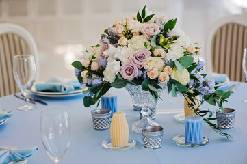 Bouquet of roses delphinium vase glasses cloth