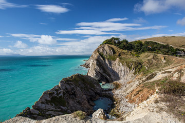 Fototapeta na wymiar Jurassic Coast in Dorset, England on summer day with blue sky