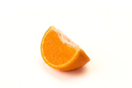 orange wedge isolated on white
