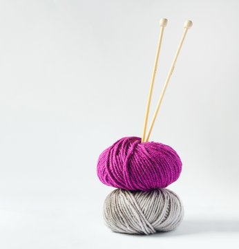 Colorful knitting yarn balls and knitting needles
