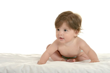 Baby girl lying on  blanket