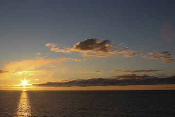 Obraz premium Clouds at sunset over the sea, sunset over the sea