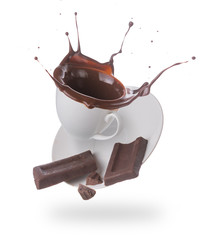 Hot chocolate splash in white cup isolated on white background