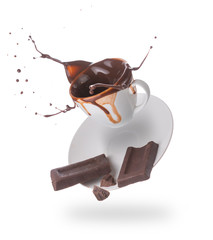 Hot chocolate splash in white cup isolated on white background