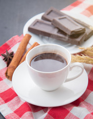 Hot Chocolate in white cups with Chocolate bar on the wooden table