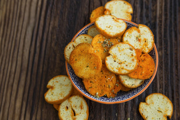 Italian appetizer baked bruschettas with spices and oregano herb