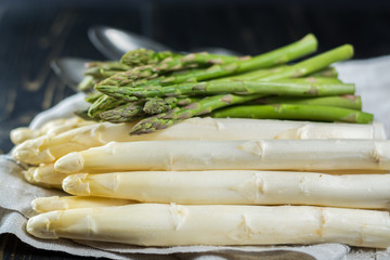 Spring season - fresh white and green uncooked asparagus