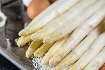 Fototapeta na wymiar Spring season - fresh white uncooked asparagus