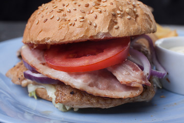 Burger with ham and tomato